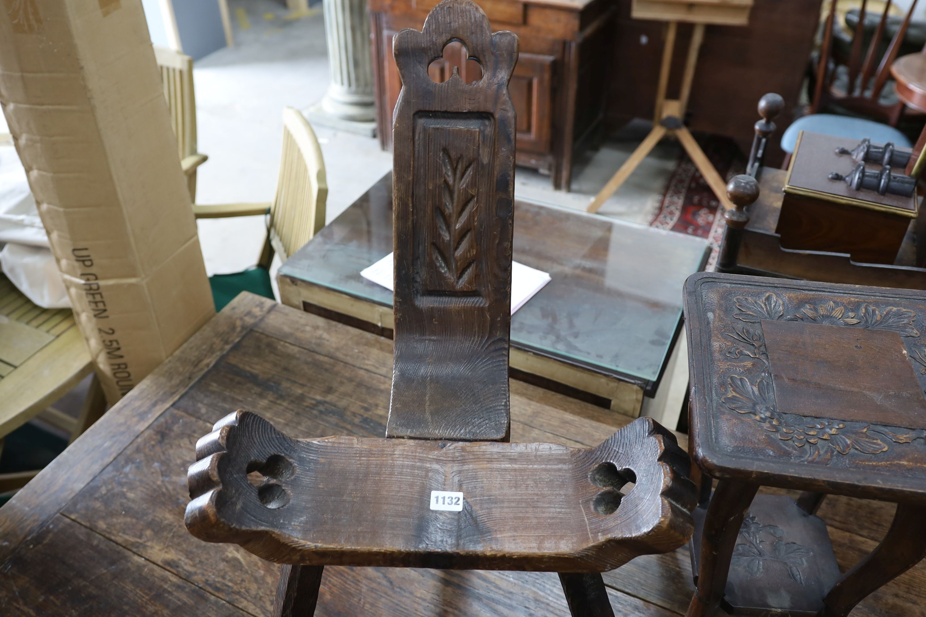 A small child's oak rocking chair, a pair of carved wood bellows and two caned tables